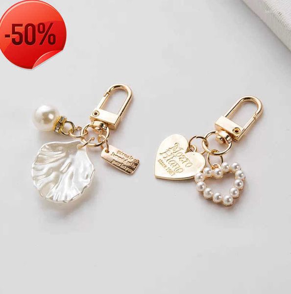 Keychains Lanyards Girls Heart Shell Changer Keychain Fashion Elegant Letter Imits Imits Pearls Cadena Bolso Homing Hanging Keyring 922ess