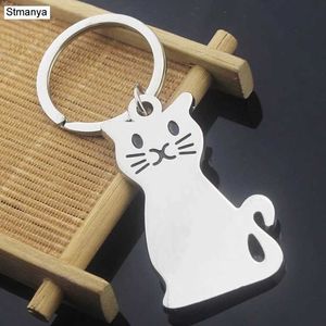 Keychains Lanyards Cartoon Cat Cat Key Chain Sac charme Accessoires Clean Ring Nouveaux hommes Femmes Couple Jewelry K2034 Q240403