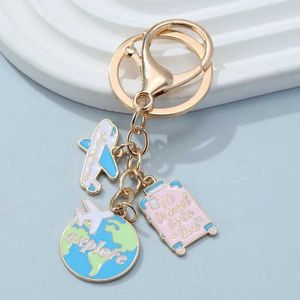 Keychains Lanyards Journey ENAMEL Keychain Earth Varine Airplane Camera Key Ring Souvenir pour fabriquer des accessoires de bijoux faits à la main bricolage Q240403