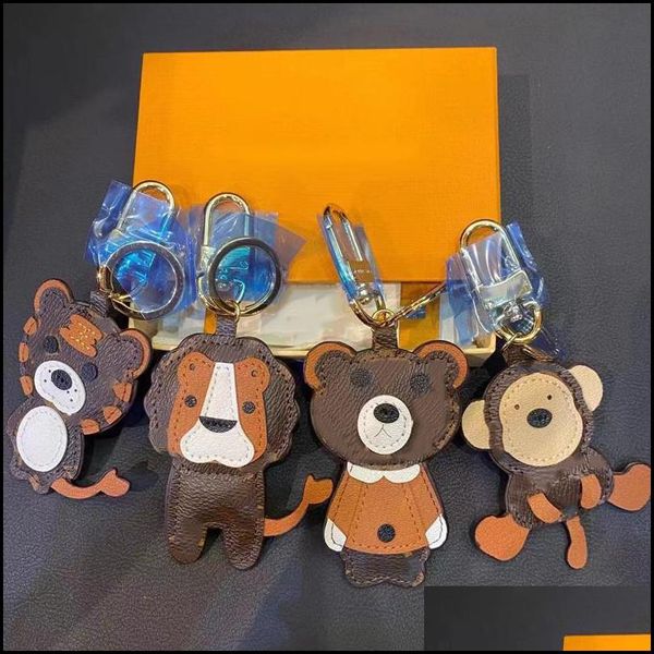 Llaveros Lanyards Lion Tiger Monkey Bear Diseñador de lujo Llavero de cuero Láser en relieve Bolsa Colgantes con caja 1853231E Drop Del245H