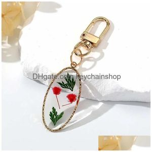 Porte-clés Longes Ovale Pressé Véritable Fleur Séchée Daisy Pendentif Porte-clés En Métal Plaqué Anneau Rotatif Bijoux R231003 Drop Deliv Dhtri