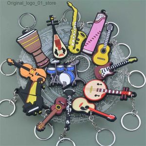 Sleutelhangers Lanyards PVC Zacht Instrument Sleutelhanger Leuke Gitaar Viool Saxofoon Sleutelhanger Rugzak Auto Ornament Muzikant Geschenken Sleutelaccessoires Q231219