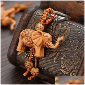 Porte-clés longes rétro sculpture sur bois éléphant porte-clés symbolise la richesse chaînes animales sac à main femme pendentif voiture Pom Diy Handmad Otfzx