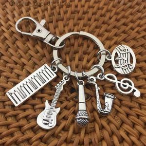 Porte-clés Longes Saxophone Notes Microphone Guitare Bande Musique Porte-clés Porte-clés Couleur Argent Femmes Bijoux Homme Accessoire Pendentif Mode Cadeau Q231220