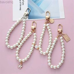 Keychains Lonyards Simulate Pearl Key Chain pour Aorpods Sac Pendentif poignet Clé perlé pour les femmes ACCESSOIRES DIY DIY DIY D240417