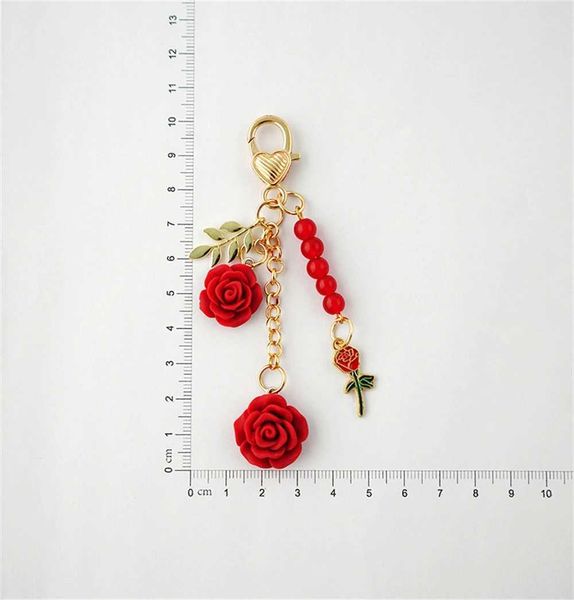 Keychains Lanyards vintage Camellia Rose Keychain Exquis Golden Love Keyring Perle Leaf Charme pour sac USB Drive Accessoire Pendant Party Gift