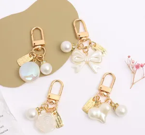 Porte-clés longes femmes mode alliage perle porte-clés pendentif créatif arc pêche coeur sac voiture porte-clés bijoux accessoires cadeau dame