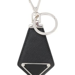 Porte-clés de luxe de luxe porte-clés en cuir noir porte-clés exquis sac de voiture à la main charmes cravate contour métal grâce mode portefeuille clé
