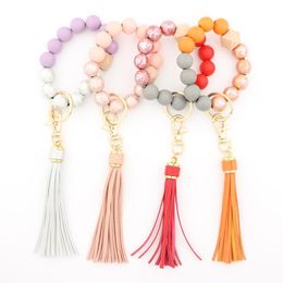 Keychains PU Leather Multicolor Tassel Bracelet Key Chain Geplitte houten kralenarmbanden voor vrouwen Fashion Boheemse tasaccessoires