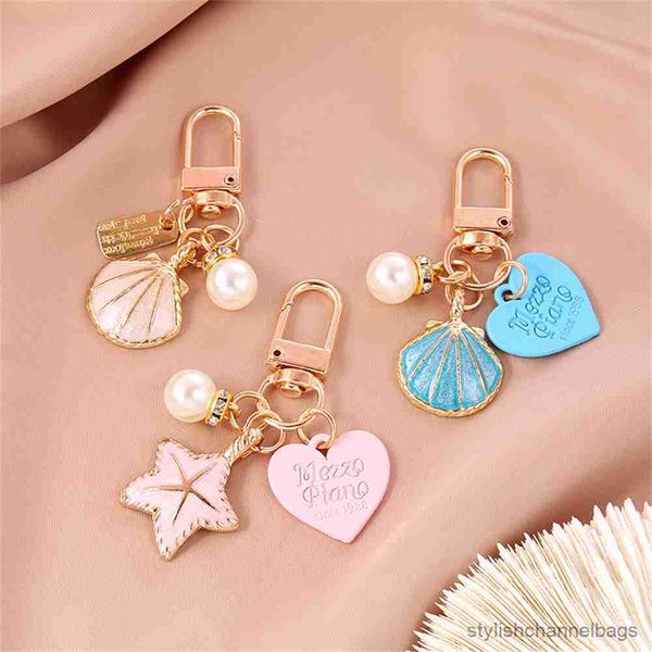Porte-clés étoile de mer petit amour porte-clés doux Romance sac pendentif étui pour écouteurs bouteille de parfum mode bijoux cadeau