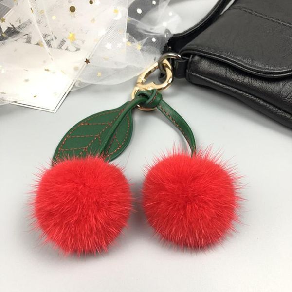 Porte-clés en gros importé véritable cerise porte-clés rouge bleu rose blanc véritable Pom sac à main pendentif bijoux en peluche