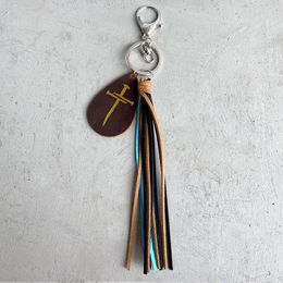 Porte-clés femmes Crazy Horse cuir porte-clés Texture bronzante tournesol croix pendentif pompon en forme de goutte