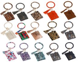 Kimter PU Turn Turne Key Chain Armbanden Car Bag Tassel Luipaard Gedrukte Bangle Pols Card Wallet Keychains Bracelet Keyring DHL6989927