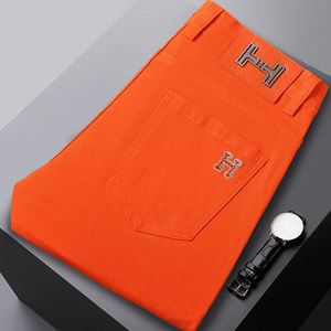 Kong Hong Summer Jeans delgados y de color naranja brillante Hombres de moda Edición coreana bordada Corea de alta gama Luxury Slim Fit Small Feet Pants