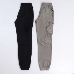 Konng gonng Primavera y verano Pantalones para hombre marca de moda retro Monos con múltiples bolsillos jogging Leggings Atar los pies 270n