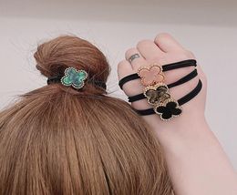 Coréen Dongdaemun rétro élégant noir bandeau Simple métal trèfle à quatre feuilles anneau de cheveux femme bandeau cheveux accessoires 7864856