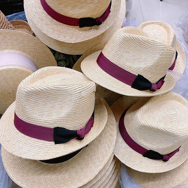 Moda coreana Vintage Curled Panamá Sombrero de paja para mujeres Summer Top Street Sunscreen Bowknot Basin Chape Feminino Worth Brim Hats