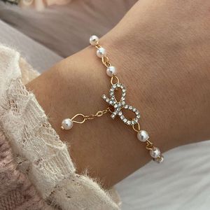 Koreaanse sieradenindustrie Nieuwe Bow Pearl Ins armband met hanger voor vrouwen HZS1725
