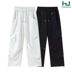 Koreaans minimalistisch basisniche -ontwerp met klinknagel geplooide casual broek voor mannen en vrouwen, rechte been, losse passende en veelzijdige lange broek