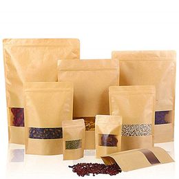 Le sac en papier Kraft à fermeture éclair tient des pochettes de scellage réutilisables avec un sac de rangement à fenêtre transparente pour le café alimentaire