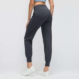 L-88 pantalons de Yoga Leggings femmes Fitness exercice nu poche latérale pêche hanche collants Joggers Sexy noir et couleurs caleçons