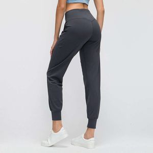 L-88 pantalons de Yoga Leggings femmes Fitness exercice nu poche latérale pêche hanche collants Joggers Sexy noir et couleurs caleçons