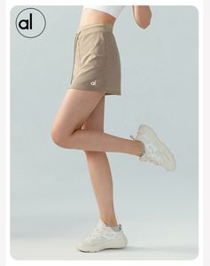 LA Même style femmes sport jupe courte plissée tennis jupe anti-exposition culottes de yoga tenues de yoga short de motard d'entraînement taille haute femmes sans couture court nouveau