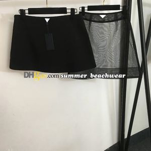 Dame kant mesh patchwork een lijn transparant uitgehold doorzichtige korte rok metalen verfraaide mesh rok sexy rok