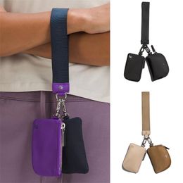 Lady Lu Dual Pouch Mincha de la pulsera Mensor masculina Monedas de lienzo de nylon Monederos Billeteras de diseñador para mujer Polso Luxurys Luxury