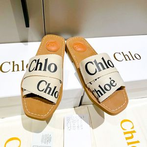 Lady White Designer Sandal Woody Mule Flat Heel Womans Man Flip Flop Tazz Slipper Luxury Slide Fashion Sandale Mandis Summer Place Place Plateforme Clog Outdoor Toile Shoe