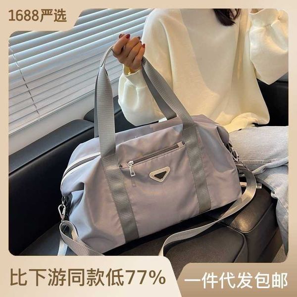 Grande capacité couleur unie bagages pour femmes marque à la mode voyage sport Fitns magasin sac à bandoulière liquidation vente
