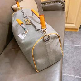 Láser Hand Luggage Bag Travel Bag Men Imploud Tote Estilo de niños Unisex High Quality Paquete204W
