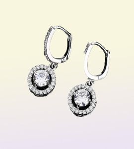 Dernières boucles d'oreilles en or blanc rond