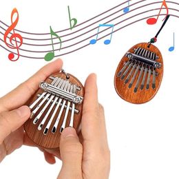 Jouets d'apprentissage 1 pièces bois Mini pouce Piano Musical 8 tons Portable débutant doigt 231031