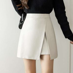 Jupe courte en cuir pour femmes, Style automne et hiver, fente irrégulière, Design amincissant, sac taille haute, hanche