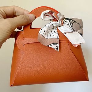 Sac cadeau de mariage en cuir Boîte de bonbons personnalisée à nœud papillon Eid Mubarak Portable Candy Jewelry Packaging Sac en gros 231227