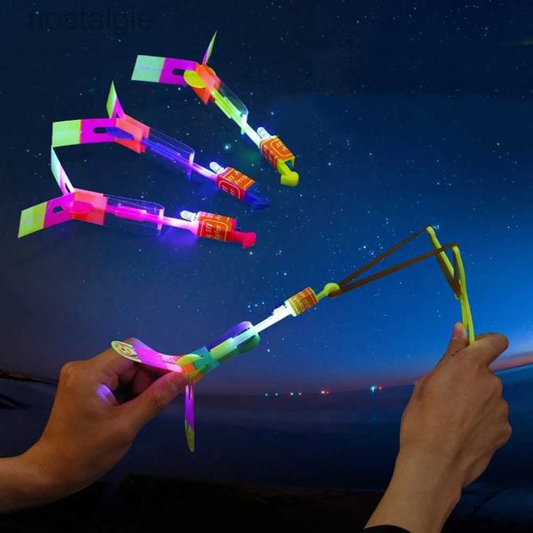 LED Flying Toys 1pc LED Flying Toys Outdoor Shining Rocket Flashing Light Slingshot Elastic Helicopter Rotation Flying Kids Toys Gift 240410