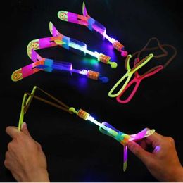 LED Flying Toys Outdoor Shinet Flash Flash Light Light Slingshot Elastic Helicopter Rotation Outdoor Flying Toy Party Party Gift Childrens Faven 240410