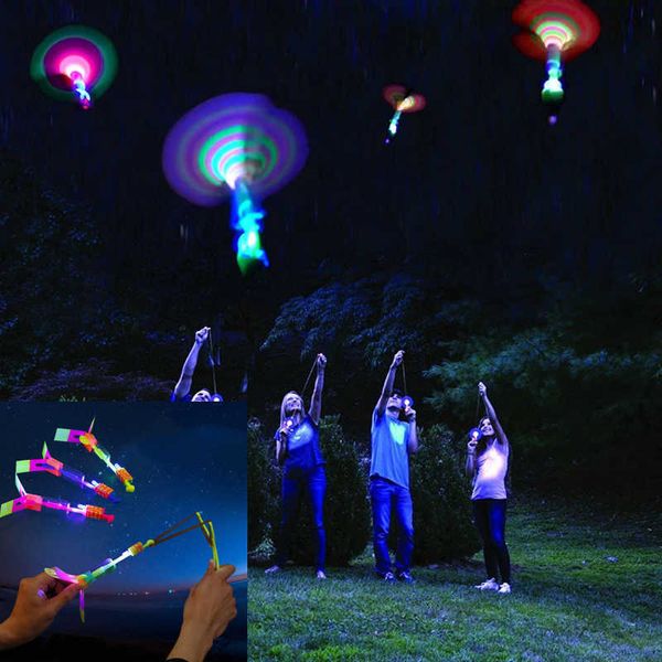 Led Light Up Luminous Flying Slingshot Juego de noche al aire libre juguetes de levitación para niños Kid