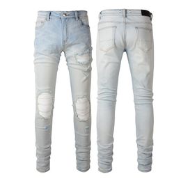 Lichtblauwe gebarsten applique denim jeans voor man ritssluiting vlieg stretch been