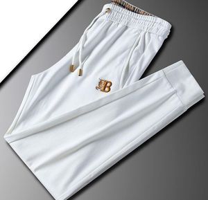 Lichte luxe Europees station High -end modemerk gebreide sportbroeken lente/zomer mode bewaker broek gouden borduurwerk slank fit kleine voeten casual broek