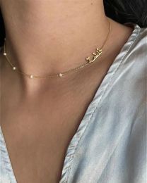 Luxury Ins Wind Arabic Nom Collier Ligaine Pendant Perle Chaîne Perle en acier inoxydable Bijoux de vacances pour femmes 231221