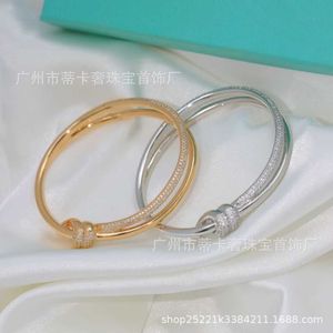Lichte luxe seiko knoop serie armband vrouwelijk goud materiaalstar dezelfde eenvoudige en gulle twist touw IW43
