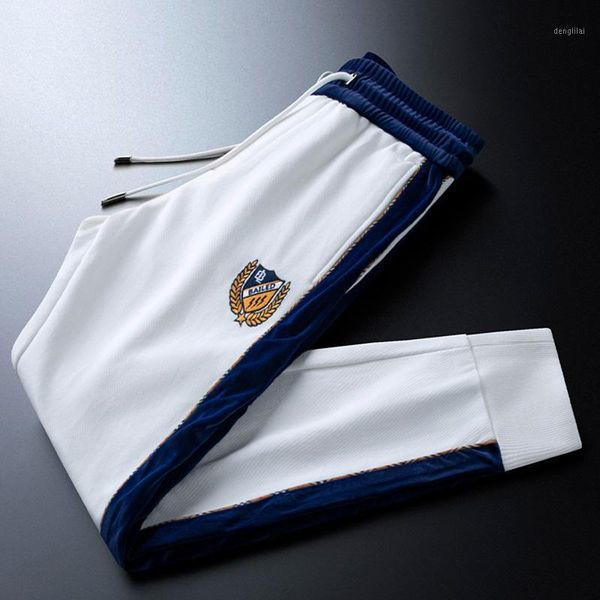 Insignia blanca de lujo ligera, pantalones deportivos informales bordados, pantalones de pie tejidos para hombre, correas laterales