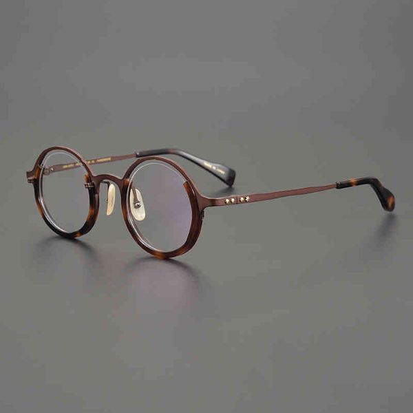 La monture de lunettes de forme irrégulière à monture ronde limitée est unique, et la monture artistique peut être assortie à