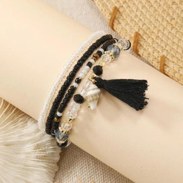Bracelets à maillons 4 pièces de style bohème avec pompon noir et perles de riz avec tempérament à la mode et ensemble de bijoux élastiques