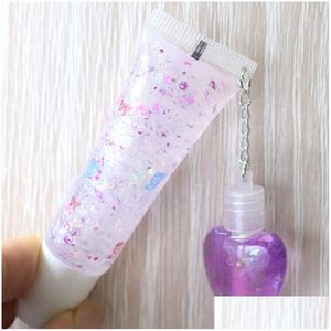 Bleau à lèvres Transparent Huile Plumper incolore Y paillettes Liquide Liquide Lèvres étanche hydratantes hydratantes claires mignonnes à lèvres avec un pendentif Drop Dhjjh