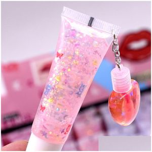 Lip Gloss Transparent Plumper Oil Incolore Sexy Glitter Lèvres Liquides Imperméable Hydratant Femmes Effacer Mignon Lipgloss Avec Pendentif Dhoqh