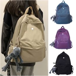 LL-124 Estudiantes Mochilas para portátiles Mochila escolar Bolsos para mujeres Deportes al aire libre Viajes Mochila informal Mochila Mochila Mochila con colgante