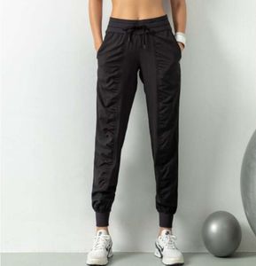 LL Pantalon de sport respirant Vêtements de sport Pantalons de jogging pour femmes Séchage rapide Slim Lâche Entraînement de course Fitness Leggings Poche à neuf points Pantalons décontractés Lululemens 1102ess